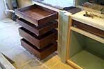American black walnut dovetail drawers waiting for painted drawer fronts to be fitted